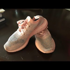 Pink adidas running shoes.